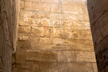 KARNAK TEMPLE - Massive columns inside beautiful Egyptian landmark with hieroglyphics, and ancient...