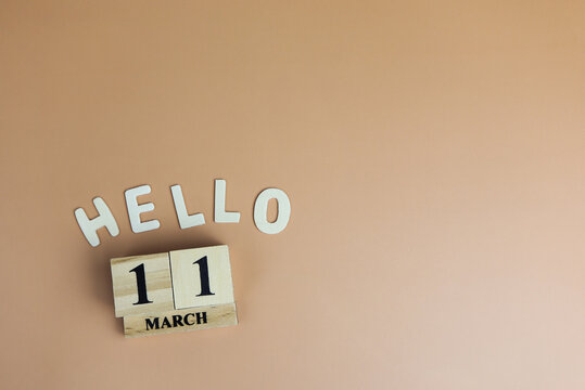 Day 11 of March month, Wooden calendar with date. Empty space for text.