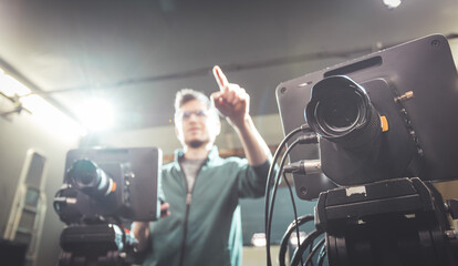 Cameraman operates a film camera, broadcasting recording studio