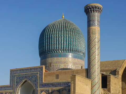 View of blue dome and minaret of Gur e Amir the mausoleum of Amir Timur or Tamerlane, a beautiful ancient landmark in Samarkand, Uzbekistan