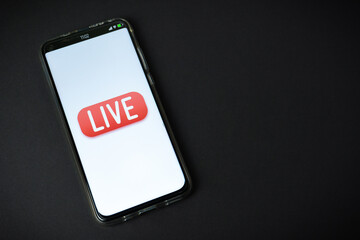 Phone with Live stream logo on black background