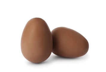 Two sweet chocolate eggs on white background
