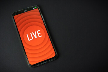 Phone with Live stream logo on black background