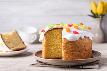 Traditional Easter cake on white wooden table. Space for text