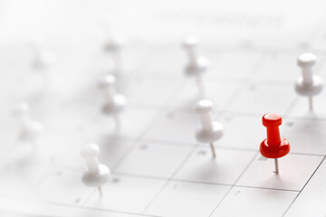 Calendar page pinned in a calender on datebusiness meeting schedule, travel planning or project milestone and reminder concept.