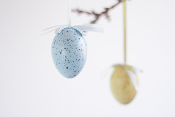decoration in the form of hanging decorative Easter eggs close-up on a light background