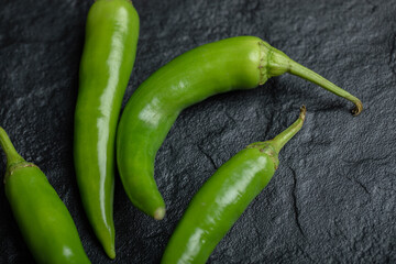 Close up photo of green hot fresh peppers