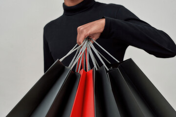 Paper shopping packets in hand of african american man