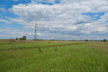 Fototapeta na wymiar Power transmission towers and clouds