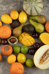 Naklejka na ściany i meble Pile of fresh whole fruit composition on marble surface