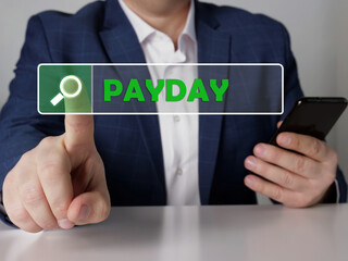 PAYDAY phrase on the screen. Marketing expert use cell technologies at office. Concept search and PAYDAY .