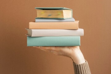 stack of books with a book