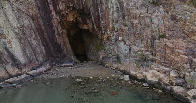 Sea cave with koi fish in Hong Kong Geopark
