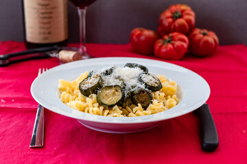Italian food: pasta with zucchini and parmesan