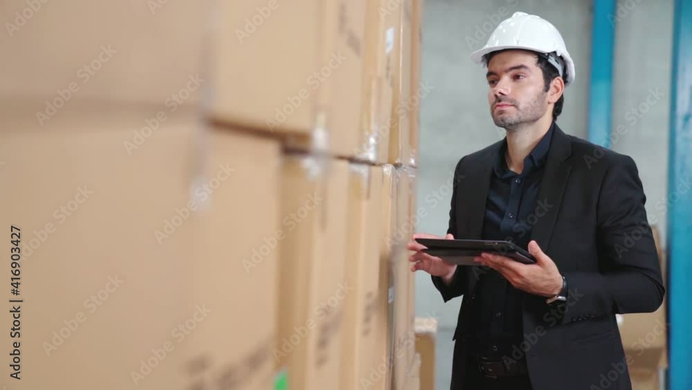 Poster factory manager using tablet computer in warehouse or factory . industry and supply chain management
