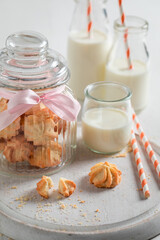 Sweet butter cookies served with milk and straw