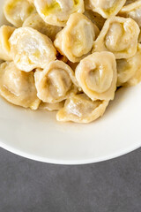 Homemade meat dumplings - russian pelmeni. Dumplings, filled with meat, ravioli.