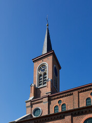 Fototapeta na wymiar Tower of a country church in Flanders Belgium