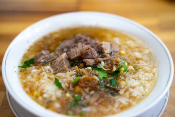 Soto Sapi is traditional Indonesian soup mainly composed of broth, meat, and vegetables, selective focus