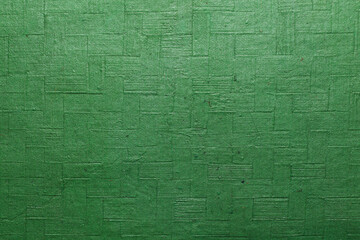 A beautiful green color handmade paper of gingham texture with veins and fibers. Useful for background, 3d rendering.