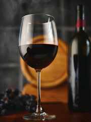 Glass of wine and grapes on the table