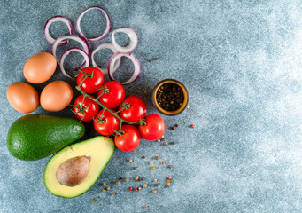 Variety of vegetables on grey concrete table top view. Healthy food background.