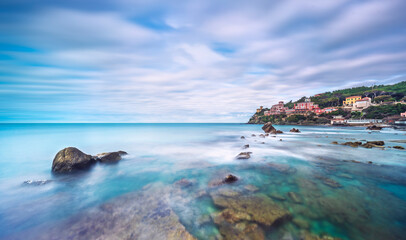 Fototapeta na wymiar Rocks and soft sea, long exposure photography landscape. Castiglioncello, Italy