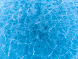 Fototapeta na wymiar Vivid blue frozen lake aerial drone view , image for natural background.