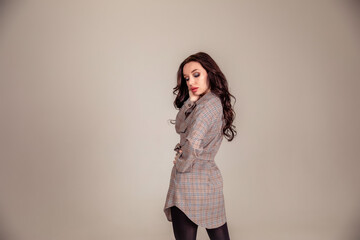 portrait of a beautiful young brunette with long hair. businesswoman