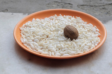 bowl of  rice pilaf  with one walnut