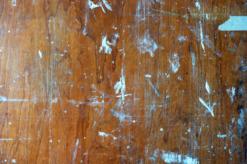 Old wooden background with colorful paint stains