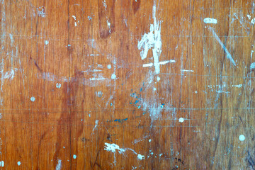 Old wooden background with colorful paint stains