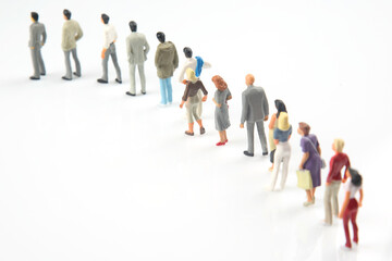 miniature people. different people stand in line one after another on a white background. communication of society of different generations
