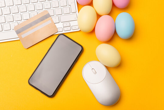 photo of smartphone with blank screen and easter eggs with credit card.