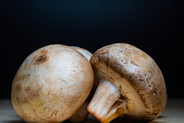 ripe large cut champignon mushrooms lie for cooking