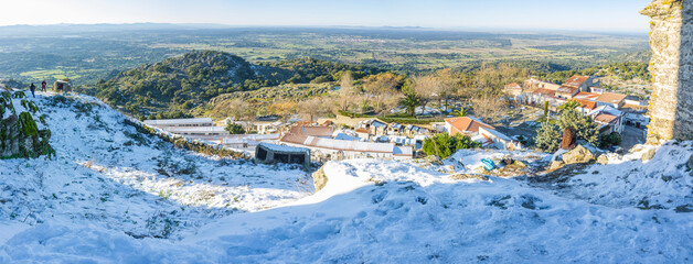 Snow-covered Montanchez town overview. Caceres, Extremadura, Spain