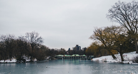 Central Park Boathouse and iced lake in New York City, USA