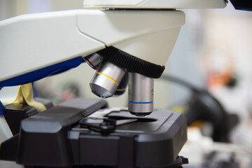MIcroscope in laboratory with blur  background.