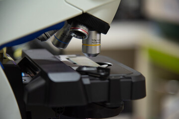 MIcroscope in laboratory with blur  background.