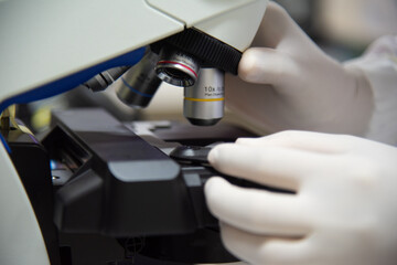 MIcroscope in laboratory with blur  background.