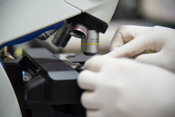 MIcroscope in laboratory with blur  background.