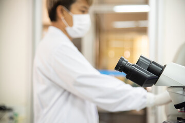 MIcroscope in laboratory with blur  background.