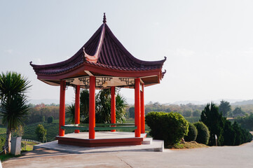 Red chinese style pavilion tea plantation background