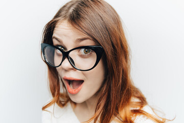 red-haired woman emotions fashionable glasses studio face close up