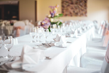 served wedding table with flowers centerpiece and glasses