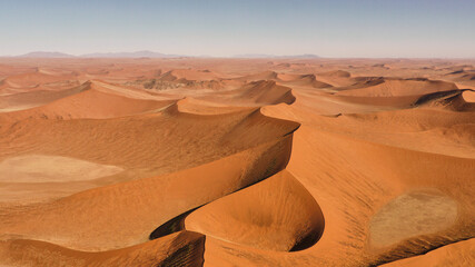 Fototapeta na wymiar flight over famous red dunes of Namib desert
