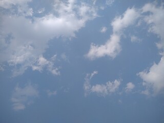 Blue sky, beautiful clouds and warm sunshine