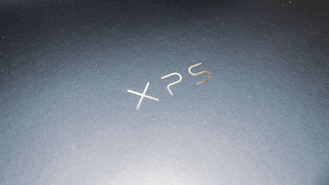 Unboxing Dell XPS Laptop. Close Up Brand Logo.Feb 2021