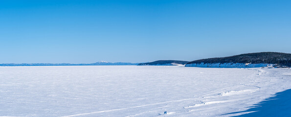 Fototapeta na wymiar Winter sea covered with ice. Panorama