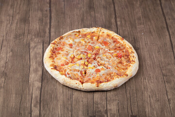 Hot Pepperoni pizza on wooden background